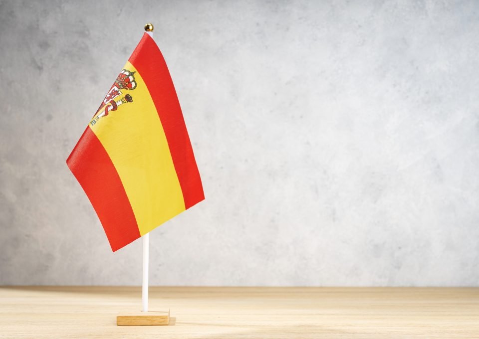 Spain flag on white textured wall